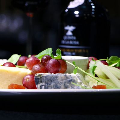 Port and cheese board with grapes.