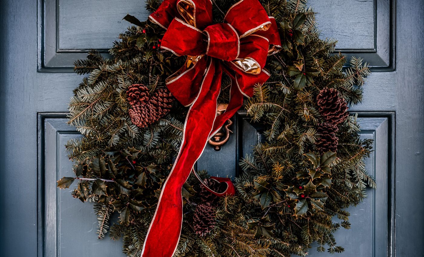 Christmas wreath hanging on door.